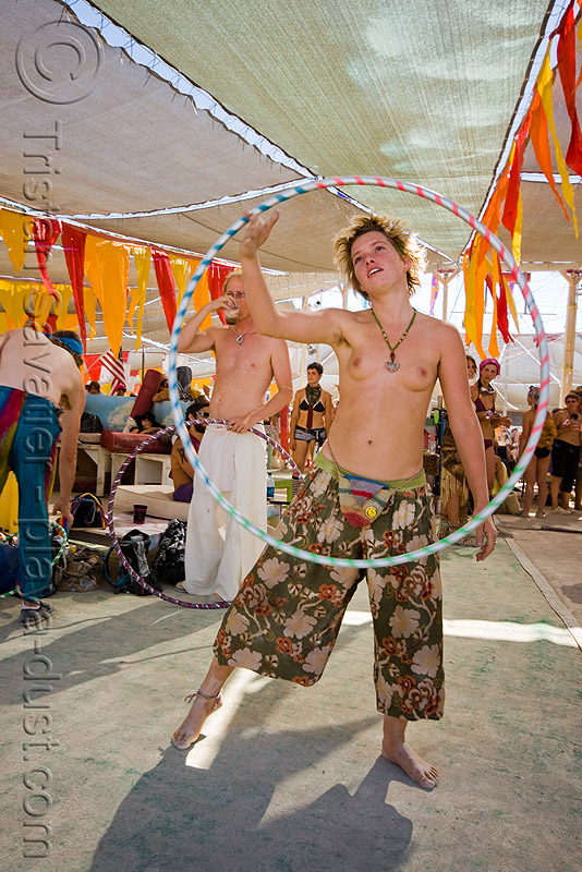gabrielle with hula hoop - burning man 2008, burning man festival, center camp, hula hooper, hula hooping, topless woman, stock photo