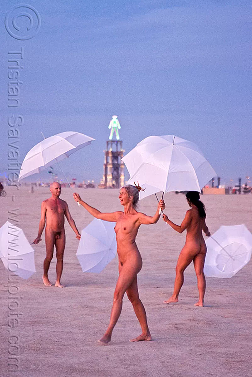 Burning Man - the Umbrella-Man Performing at Dawn