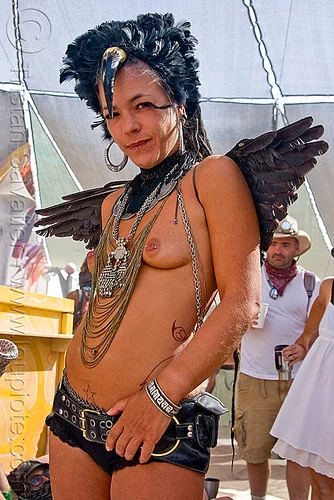 black angel, angel wings, attire, black angel, black feathers, burning man outfit, chain necklace, costume, dark angel, delfine, headdress, metal necklace, necklaces, topless, woman