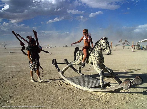 burning man - giant rocking horse, art installation, giant rocking horse, horseback riding, man