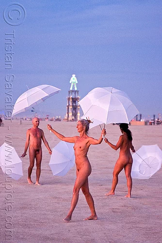 burning man - the umbrella-man performing at dawn, dawn, nude, performance, the man, u-man, umbrella man, white umbrellas, women