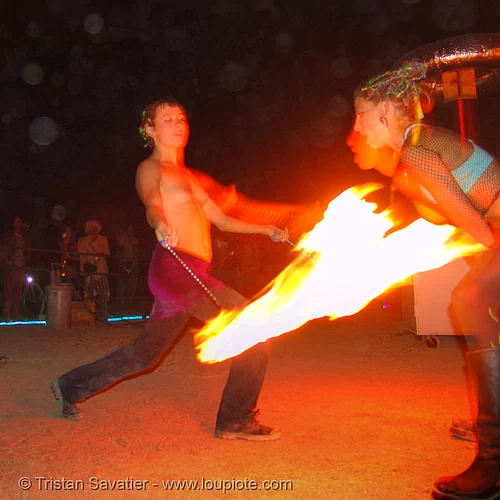 fire performers - decon and raine, fire dancer, fire dancing, fire performer, fire spinning, night, raine, shaina, spinning fire