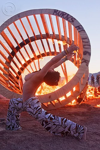 woman dancing near fire, burning, cylinder, cylindrical, dancing, dusk, fire, frame, heather, stretching, topless, woman, wood, wooden