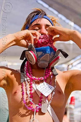 woman wearing pink and blue, bandana, dog tag, dust mask, headband, melissa, msa respirator, necklaces, topless, woman
